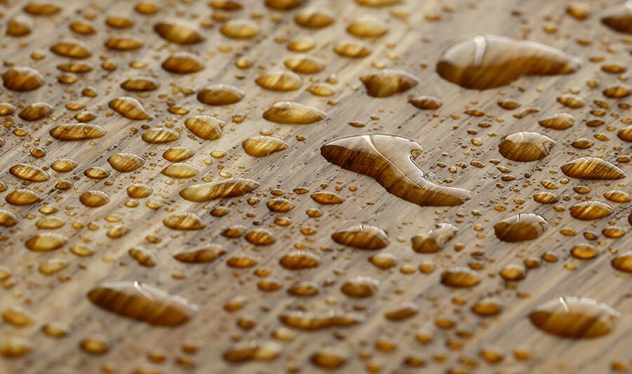 Water droplets on wood