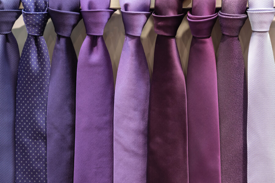 Row of purple neckties